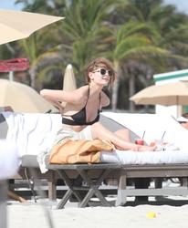 http://img169.imagevenue.com/loc1129/th_312728870_Mischa_Barton_Bikini_Candids_on_the_Beach_in_Miami_December_27_2011_238_122_1129lo.jpg